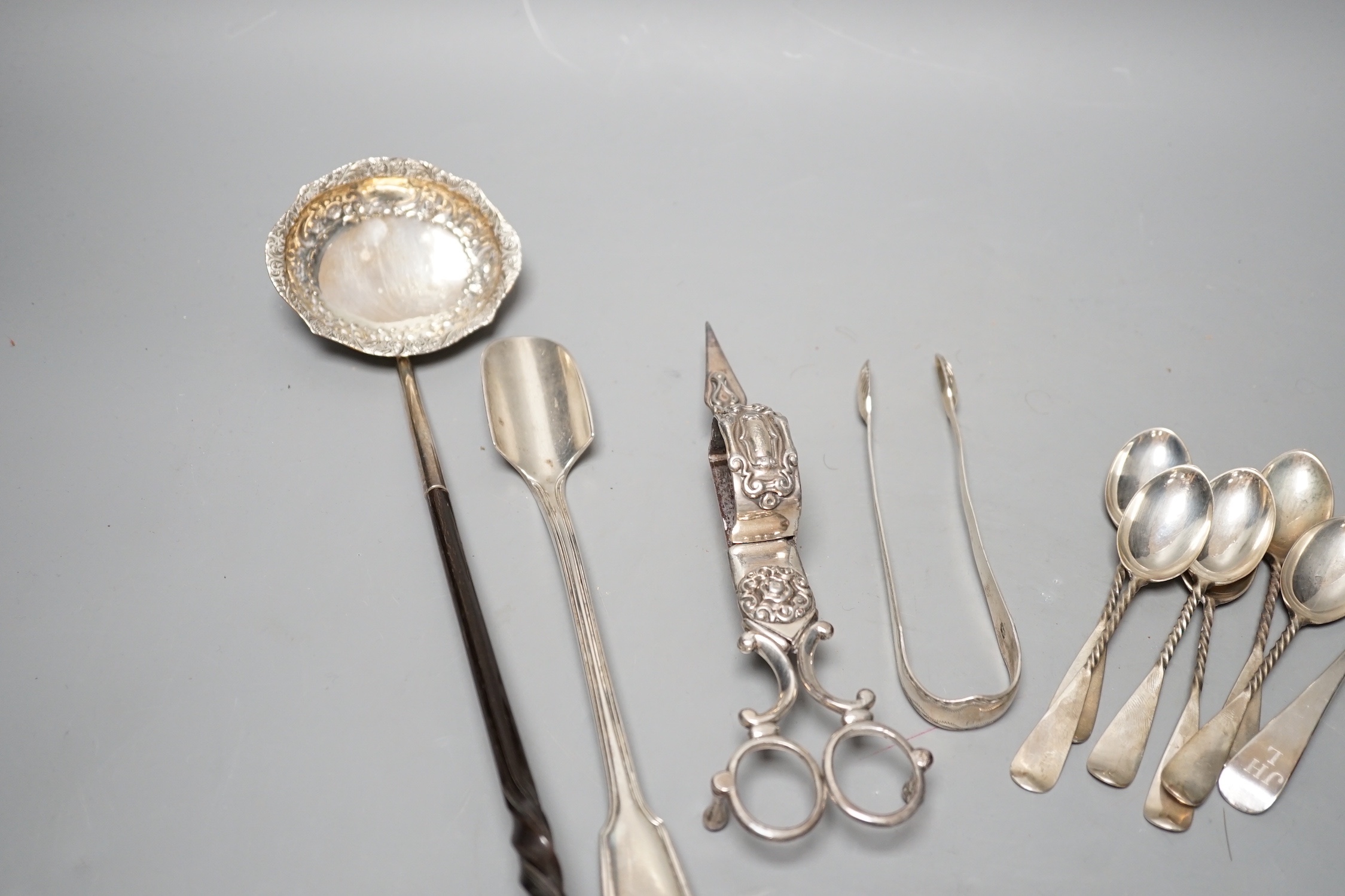 A Victorian silver fiddle and thread pattern stilton scoop, George Adams, London, 1852, 22.3cm, a small group of silver flatware and a plated toddy ladle and pair of candle snuffers.